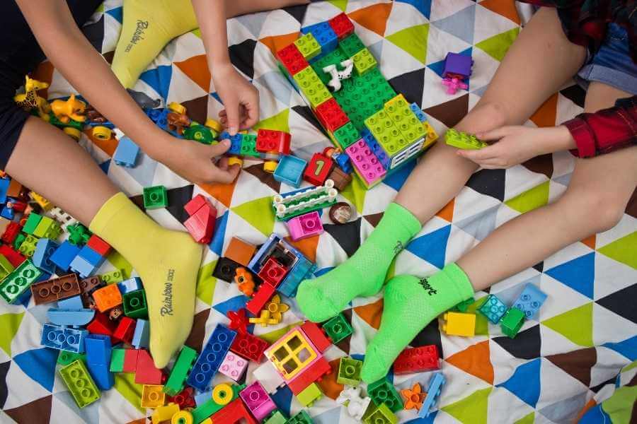 Rainy day activities with kids – kids playling with blocks.  